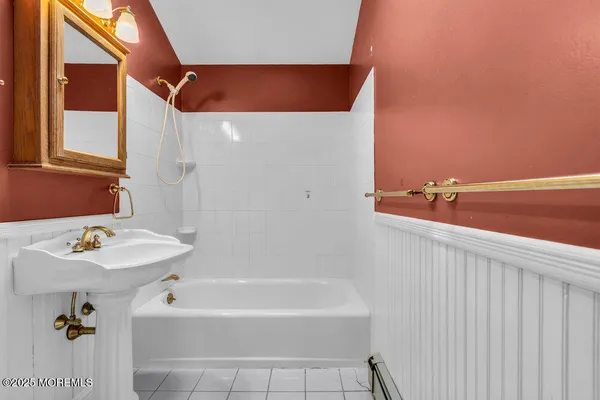 a bathroom with a bathtub and a sink