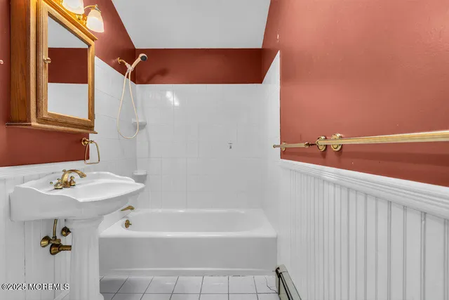 a bathroom with a bathtub and a sink