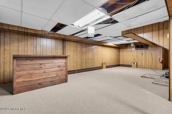 a view of hallway with wooden walls