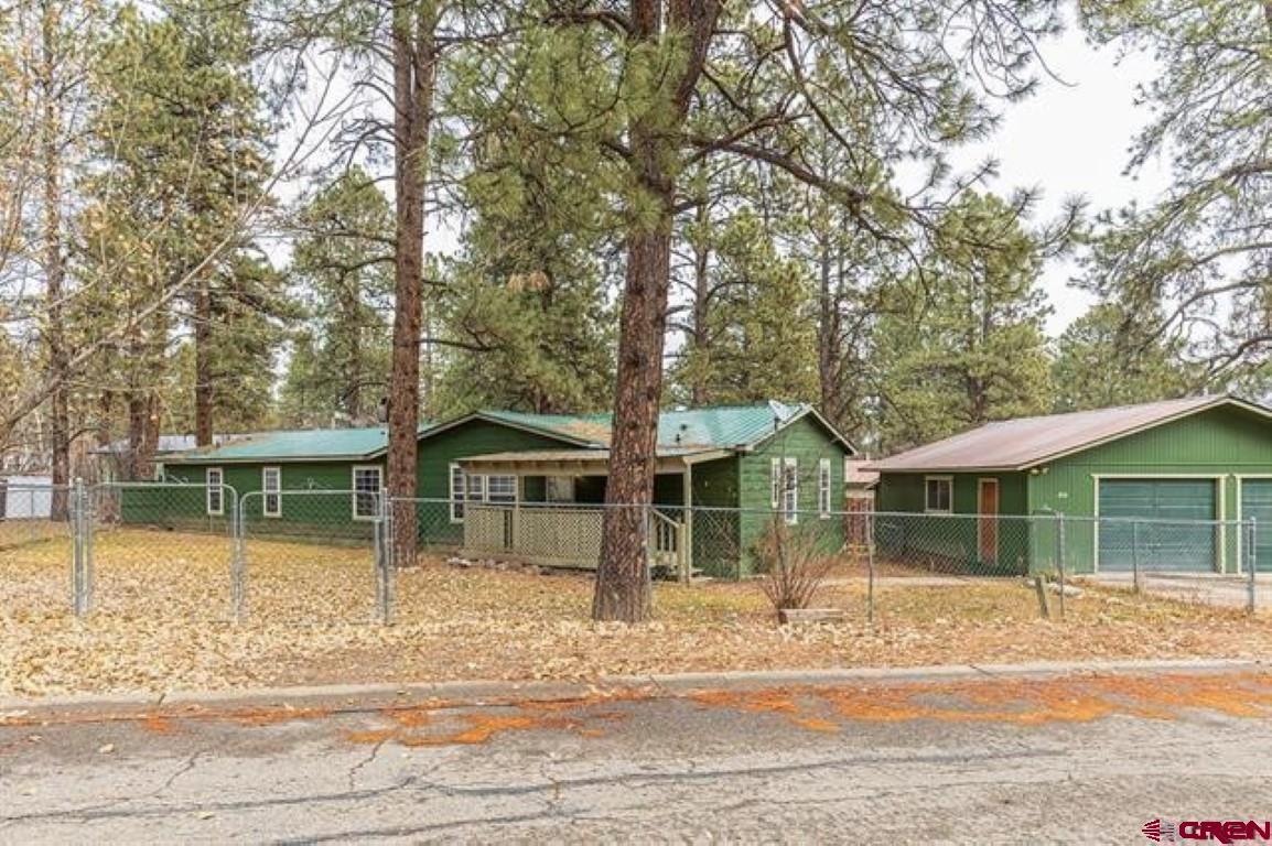 32 Hidden Lane Durango, CO 81303 - Photo 2 of 26 a front view of a house with a garden