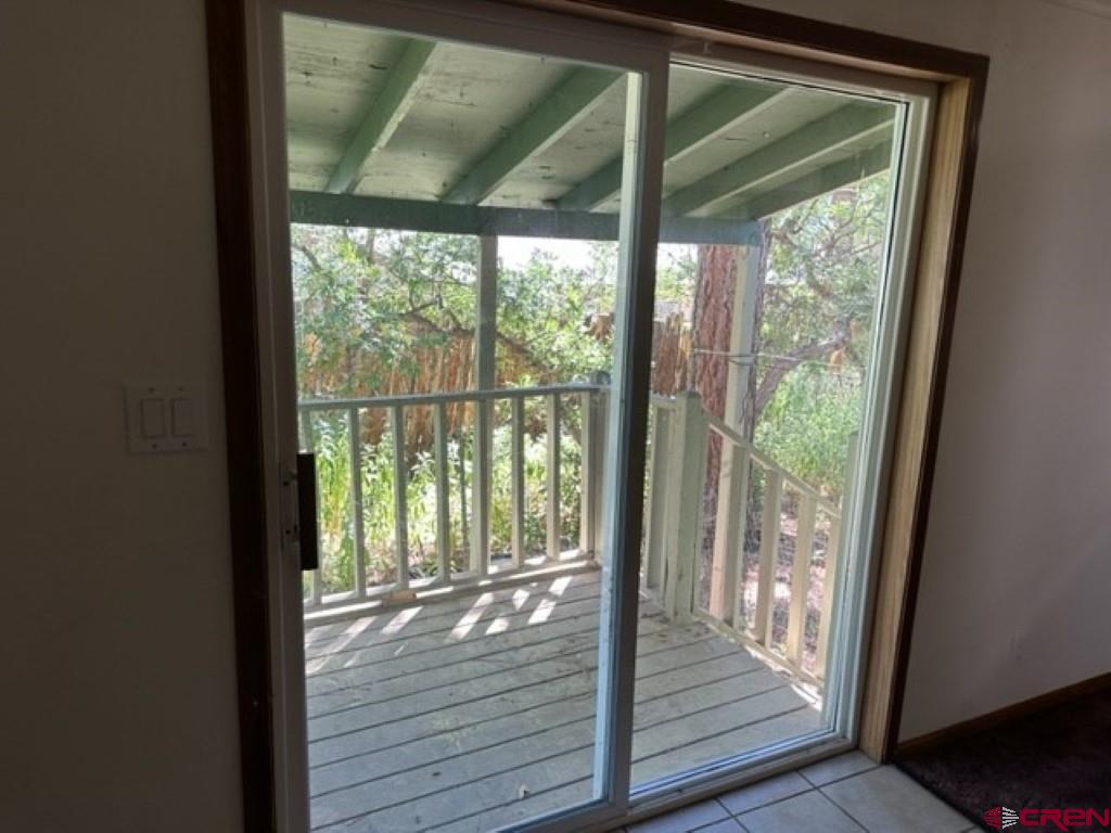 32 Hidden Lane Durango, CO 81303 - Photo 21 of 26 a view of wooden floor wooden floor and brick walls