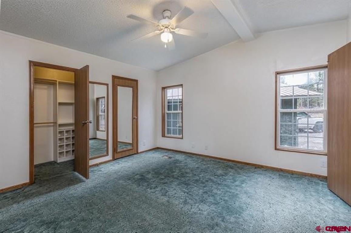 32 Hidden Lane Durango, CO 81303 - Photo 8 of 26 an empty room with windows and closet