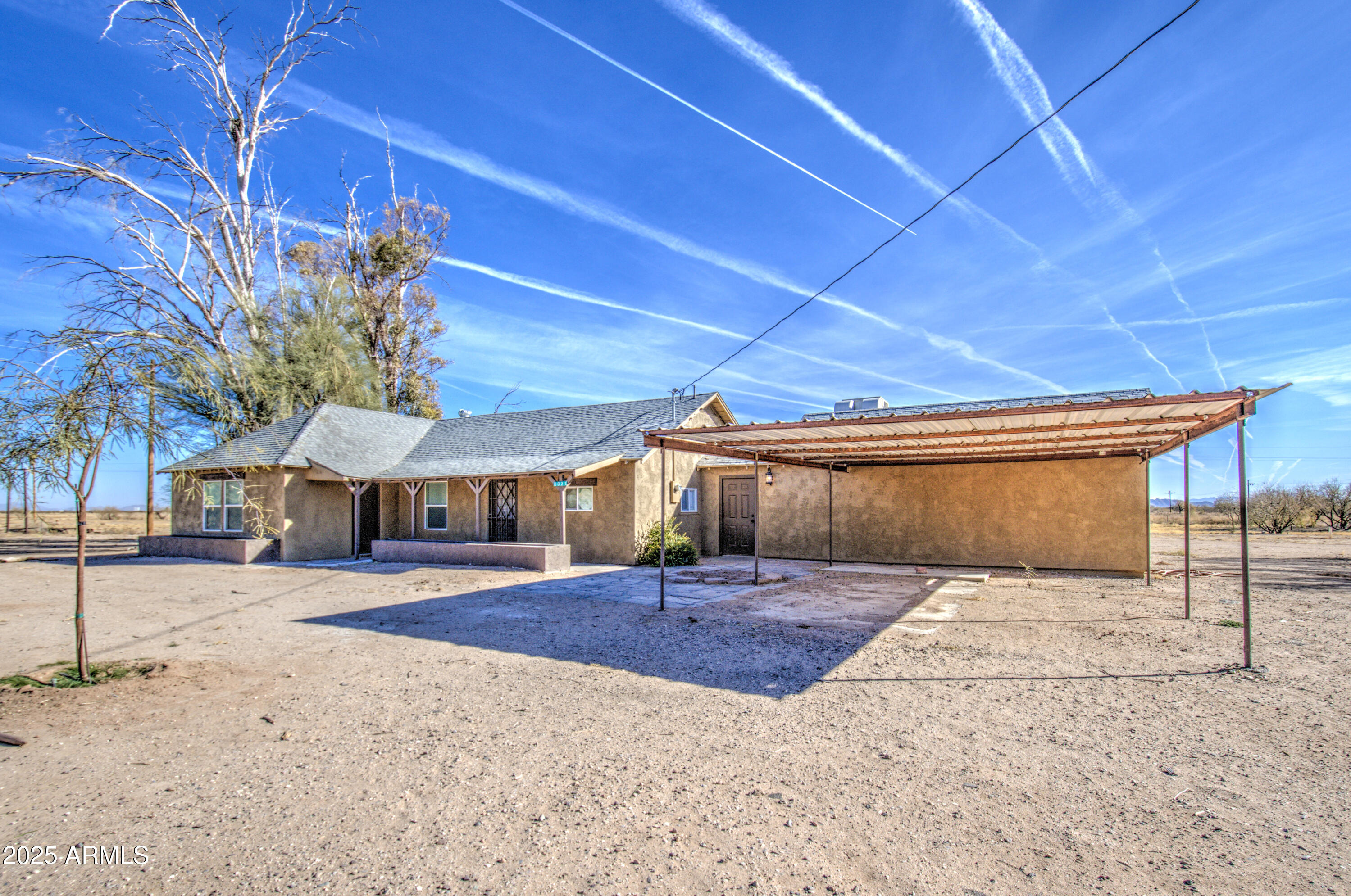 8050 South Bianco Road Casa Grande, AZ 85193 - Photo 19 of 96 a front view of a house with a yard