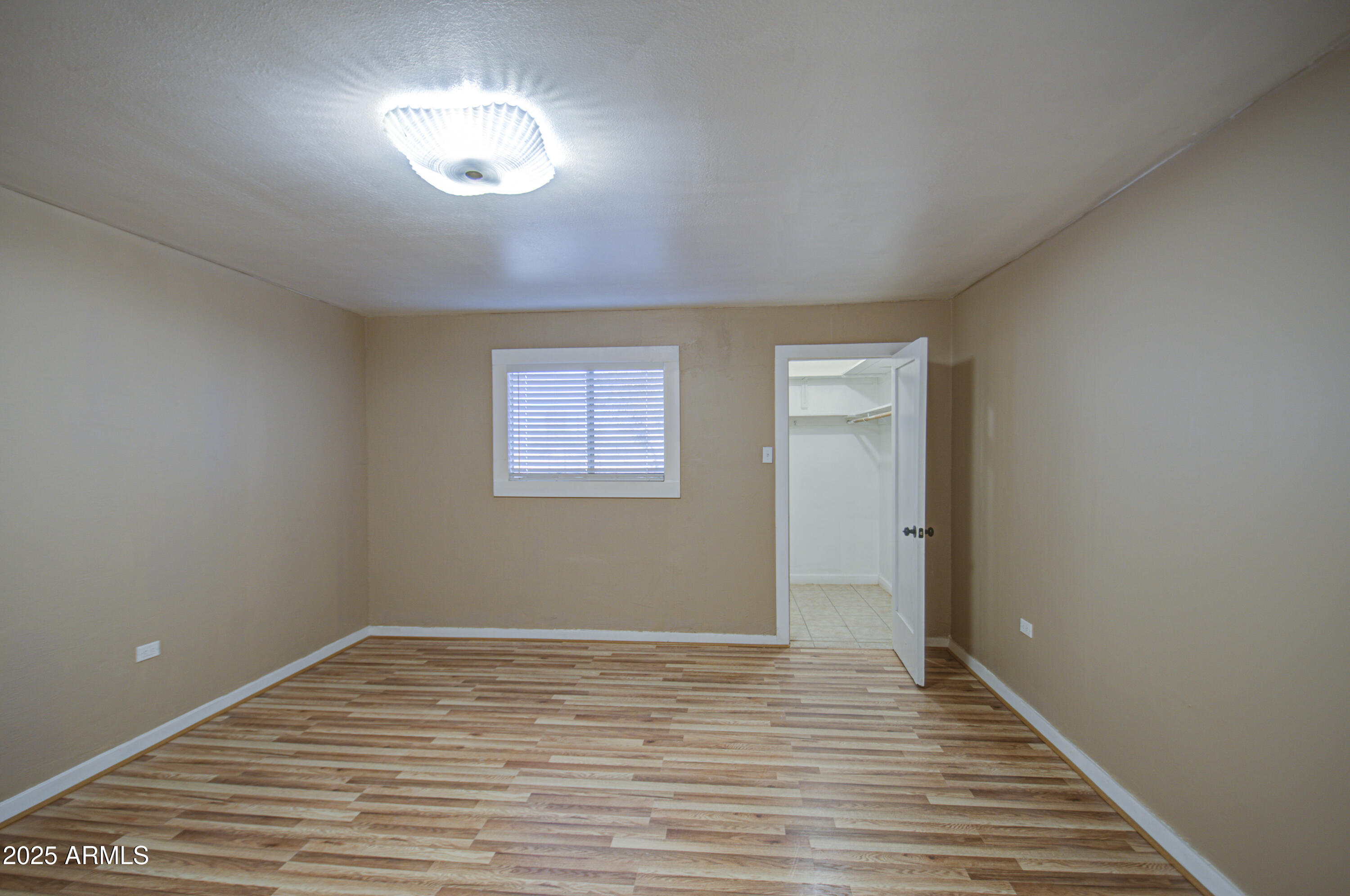 8050 South Bianco Road Casa Grande, AZ 85193 - Photo 27 of 96 a view of empty room with wooden floor and fan