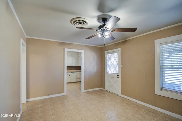a kitchen with granite countertop a sink cabinets and wooden floor