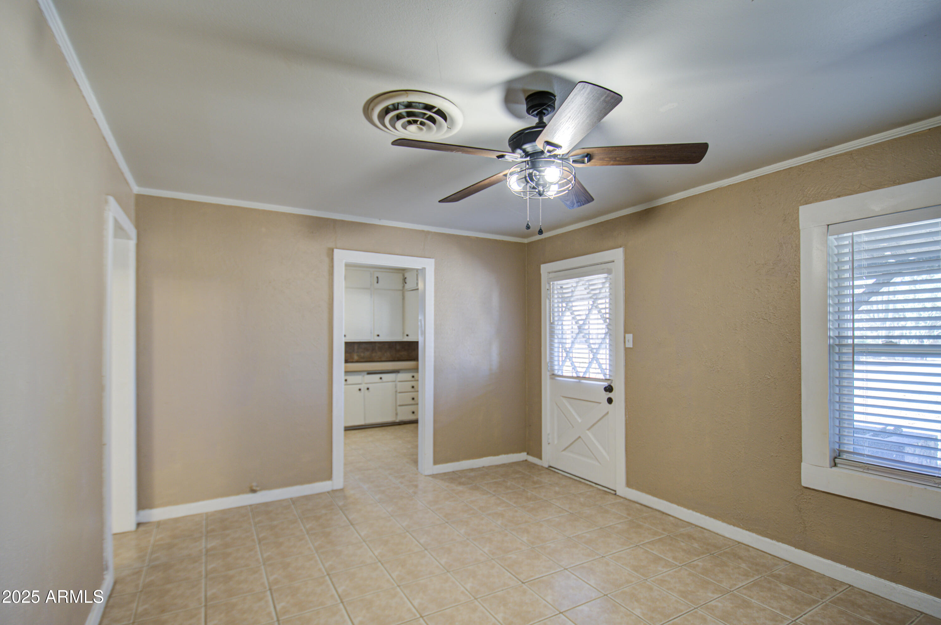 8050 South Bianco Road Casa Grande, AZ 85193 - Photo 35 of 96 an empty room with windows and cabinet