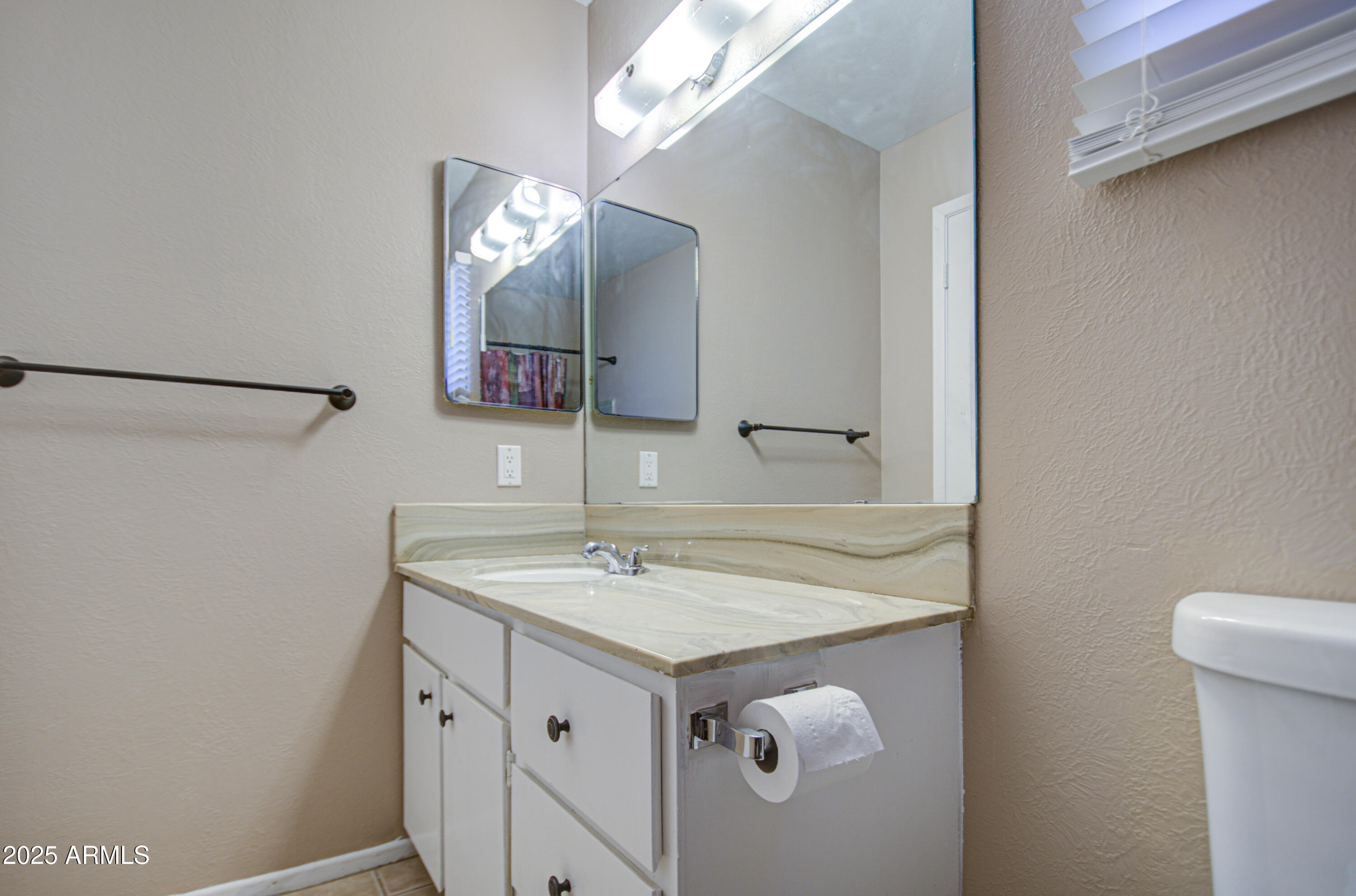 8050 South Bianco Road Casa Grande, AZ 85193 - Photo 43 of 96 a bathroom with a sink vanity and a mirror