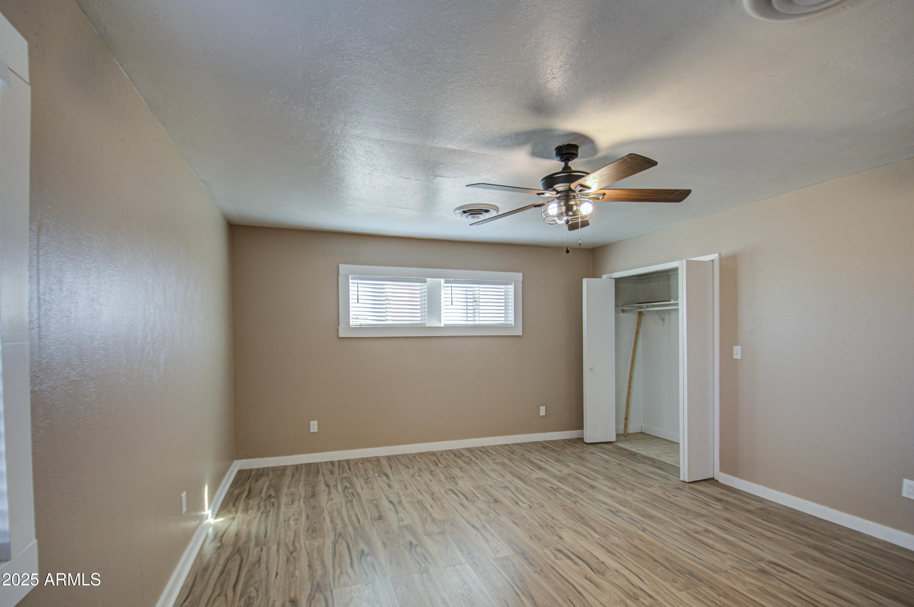 8050 South Bianco Road Casa Grande, AZ 85193 - Photo 44 of 96 a view of a livingroom with a ceiling fan and window