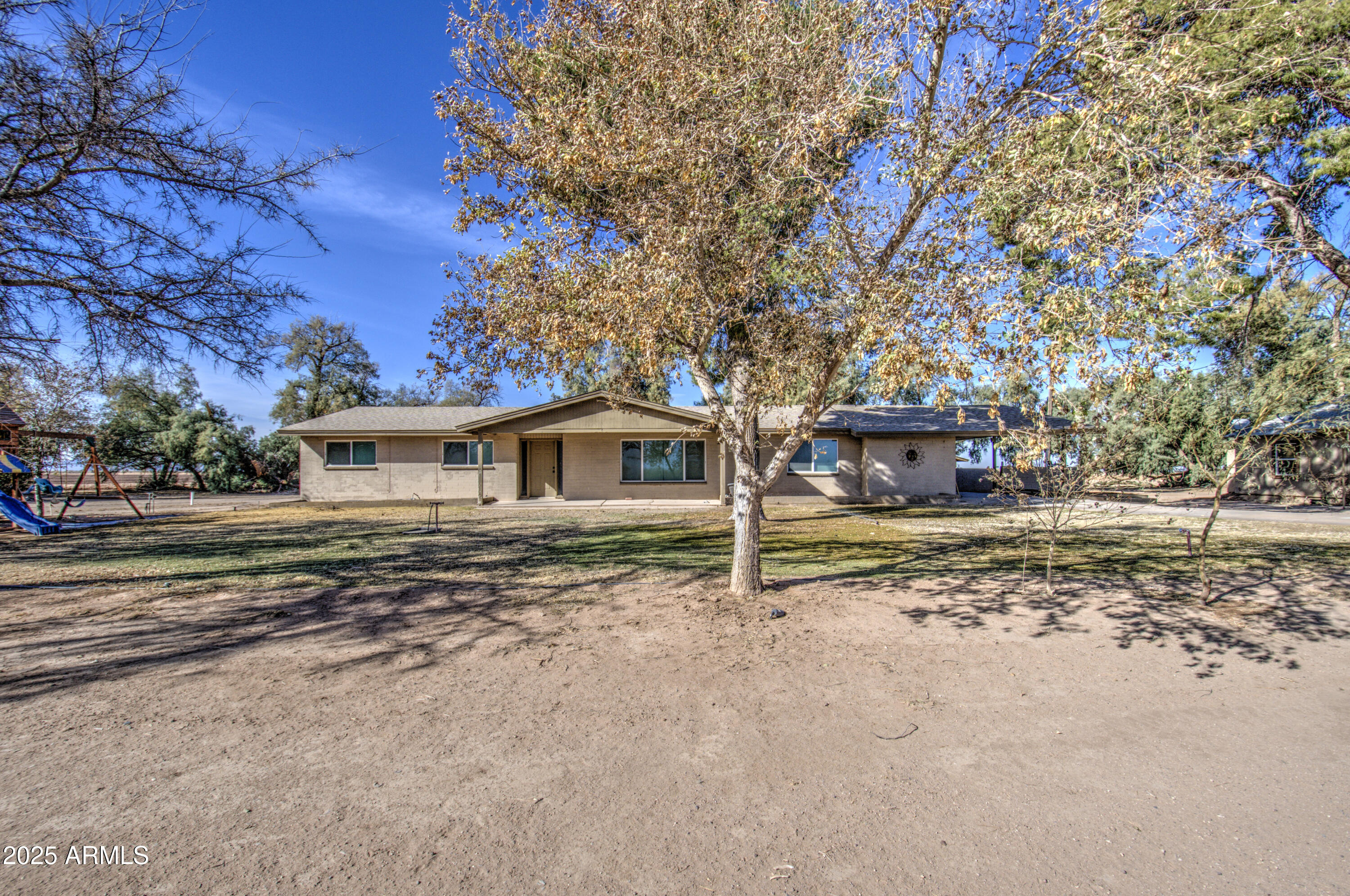 8050 South Bianco Road Casa Grande, AZ 85193 - Photo 60 of 96 a front view of a house with a yard