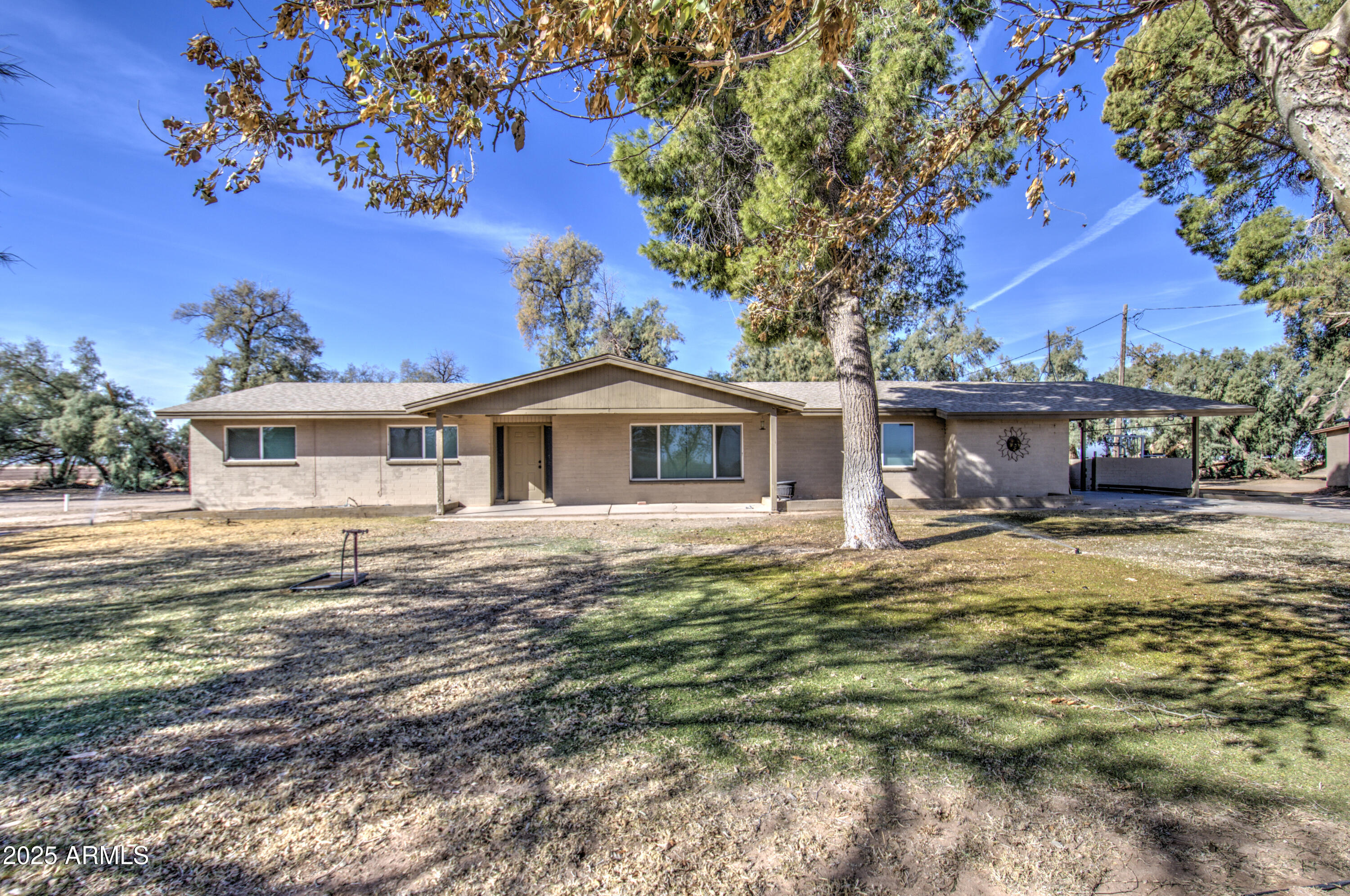 8050 South Bianco Road Casa Grande, AZ 85193 - Photo 61 of 96 a front view of a house with garden