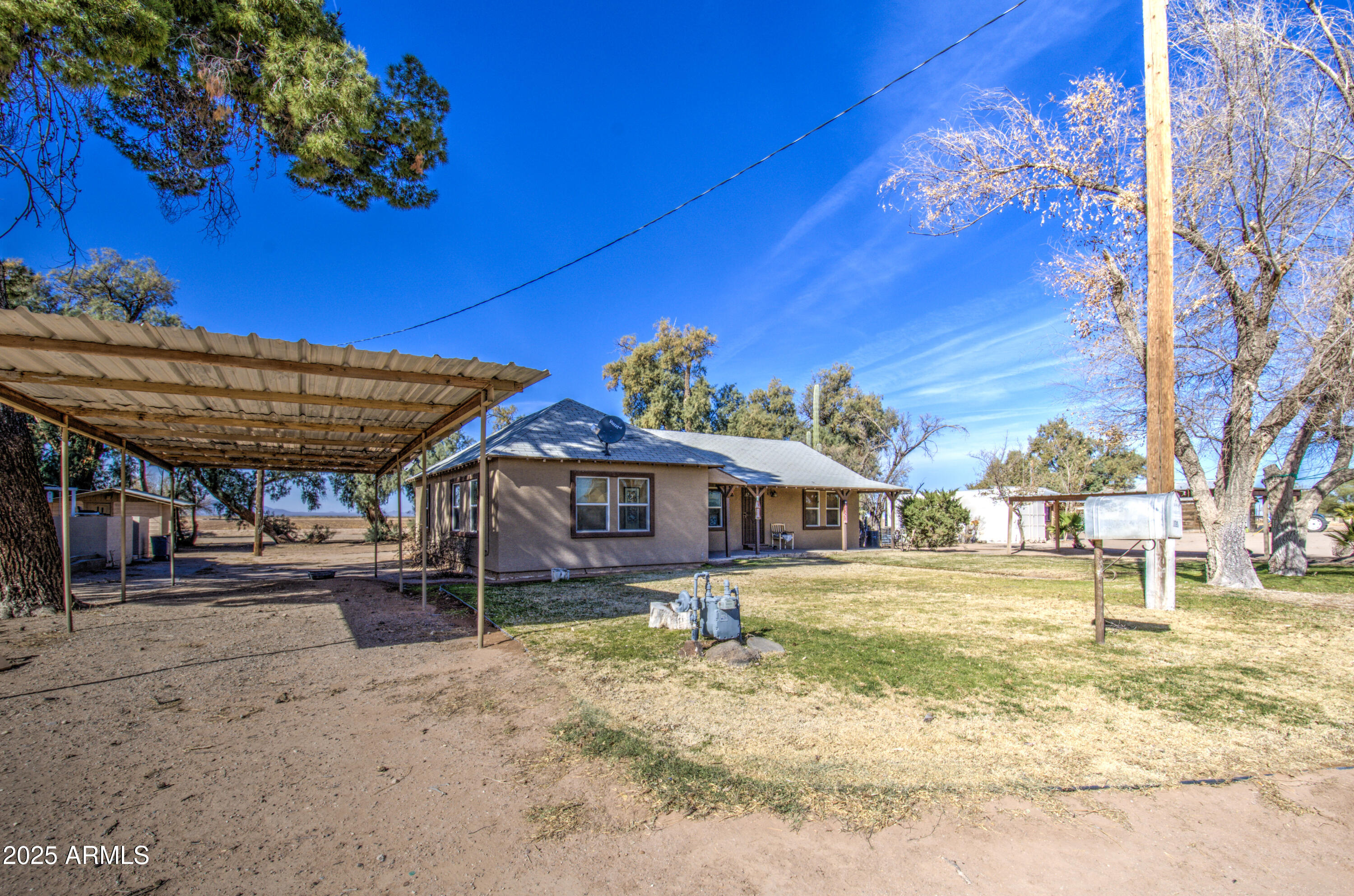 8050 South Bianco Road Casa Grande, AZ 85193 - Photo 8 of 96 a view of a house with a backyard porch and sitting area