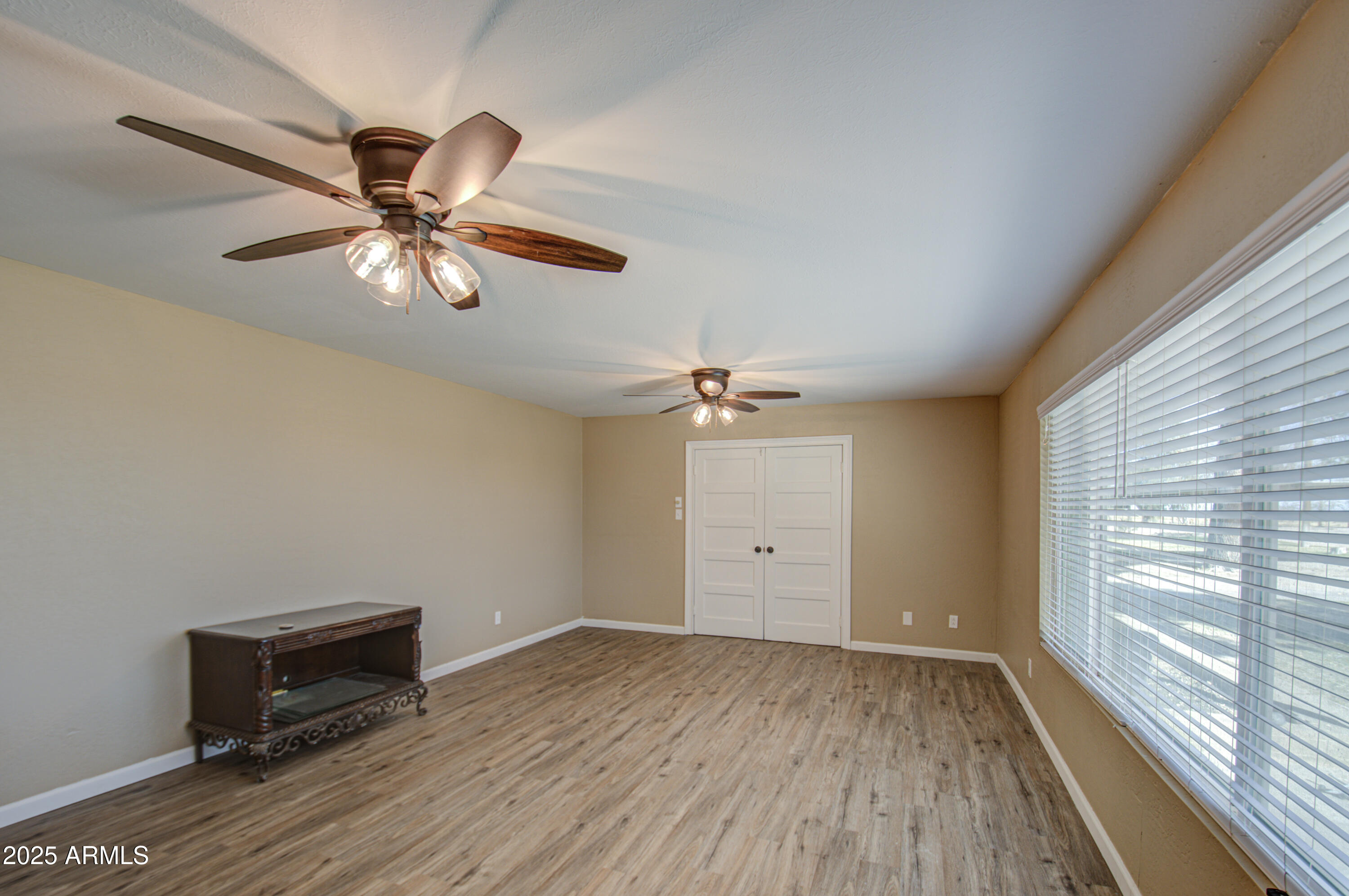 8050 South Bianco Road Casa Grande, AZ 85193 - Photo 87 of 96 wooden floor in an empty room with a window