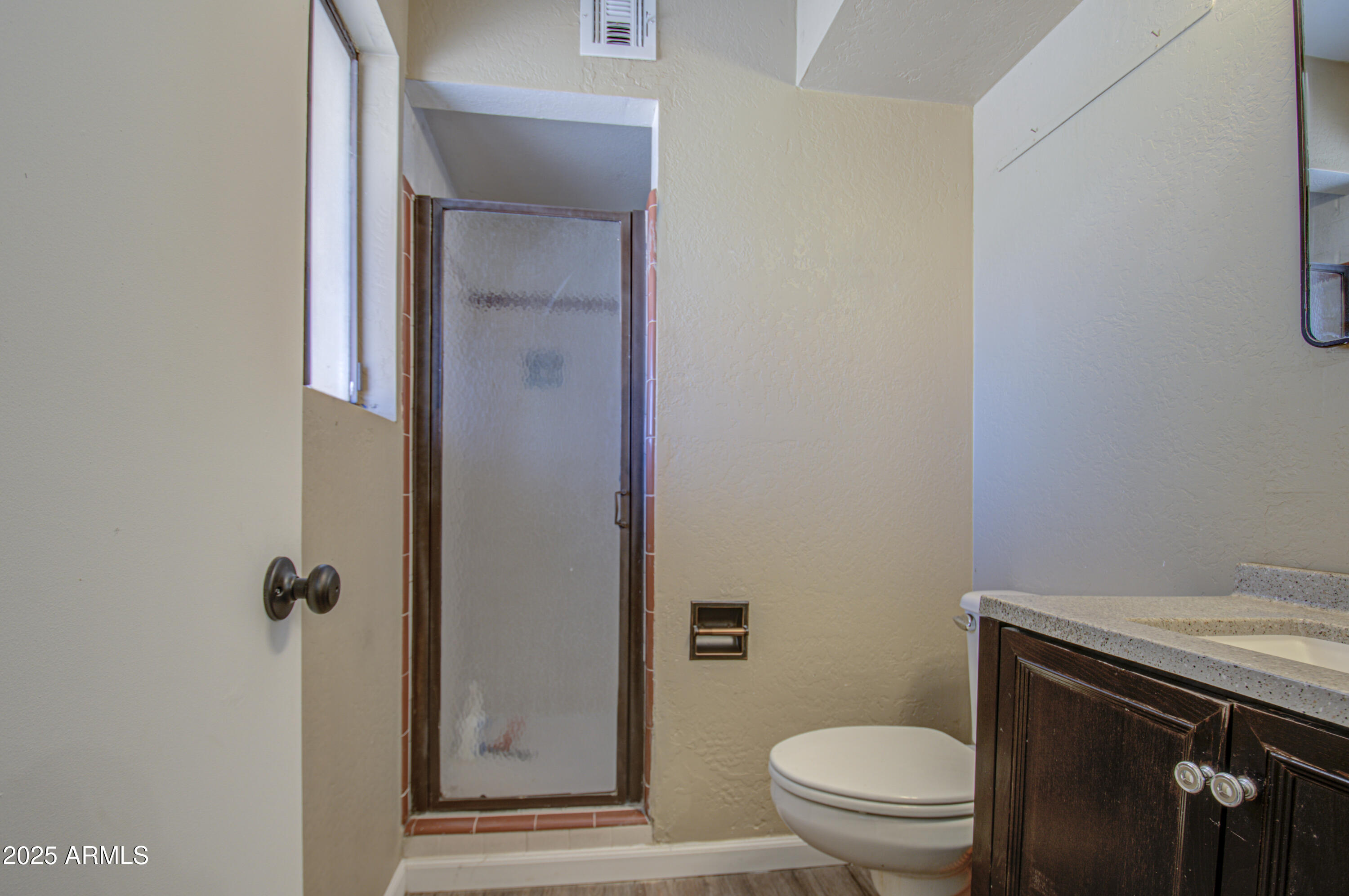 8050 South Bianco Road Casa Grande, AZ 85193 - Photo 89 of 96 a bathroom with a granite countertop toilet and a sink