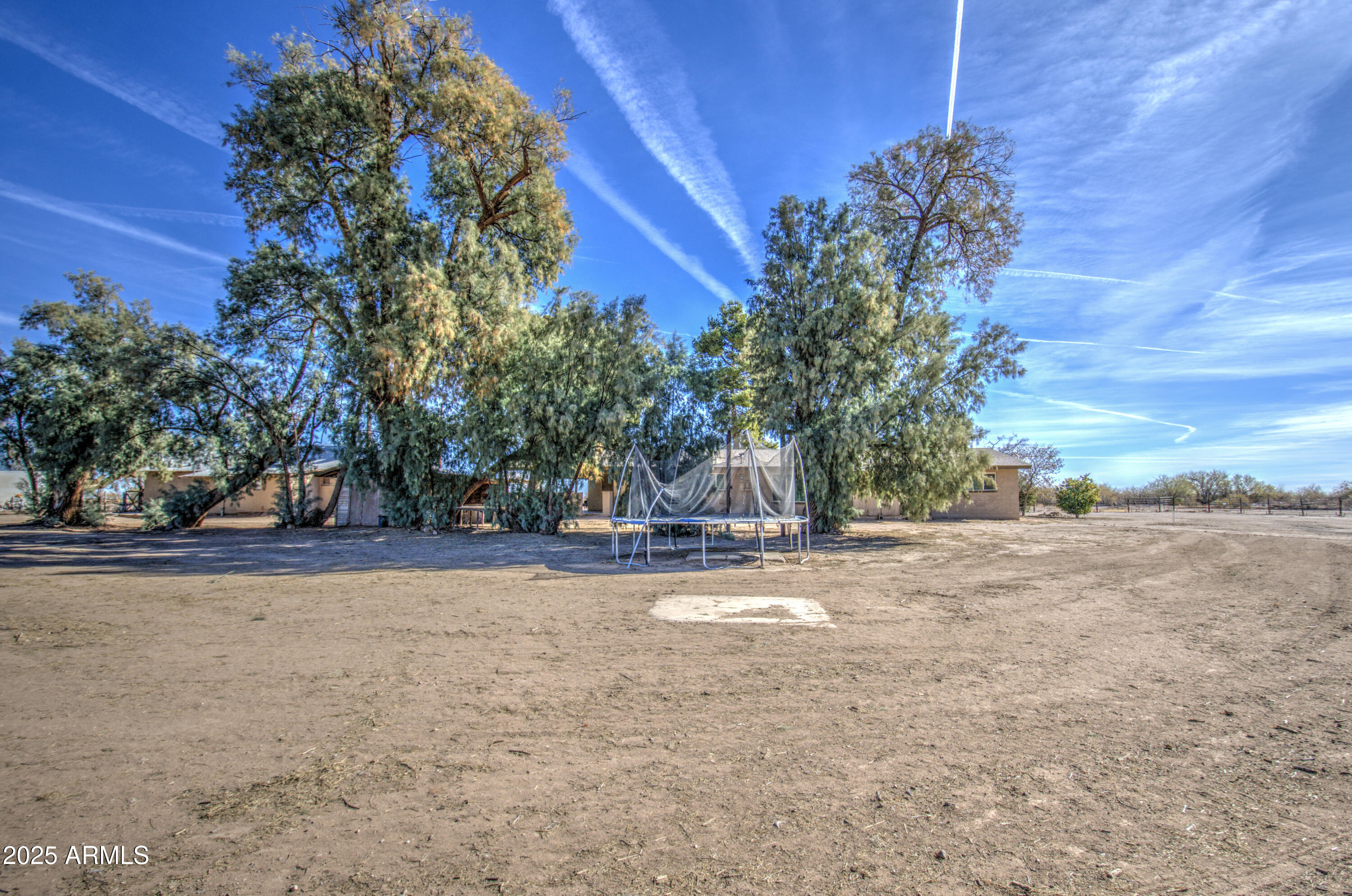 8050 South Bianco Road Casa Grande, AZ 85193 - Photo 95 of 96 a view of a house with a tree and a yard