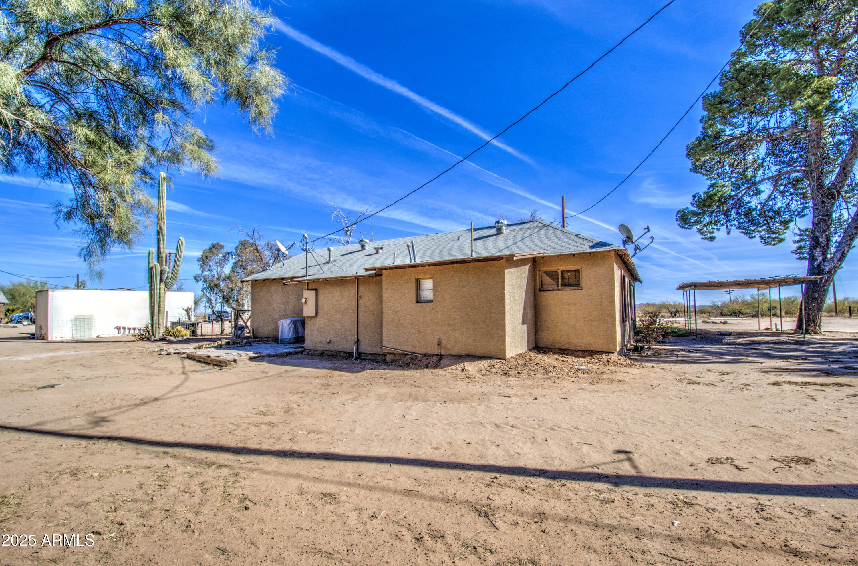 8050 South Bianco Road Casa Grande, AZ 85193 - Photo 10 of 96 a view of a house with a snow in the yard