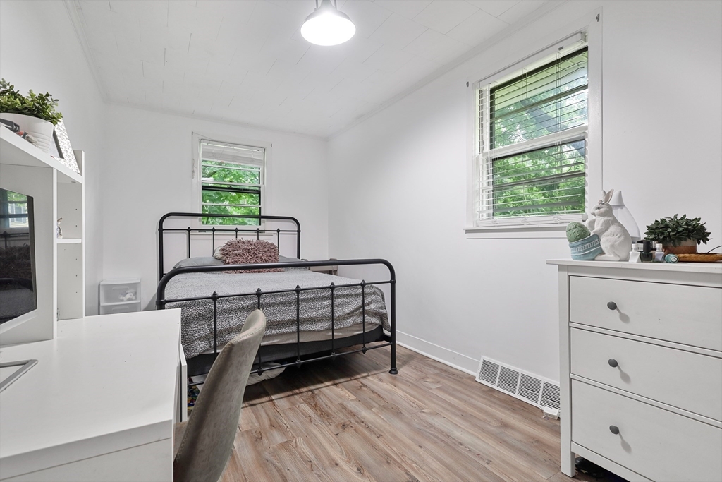 17 Pine Street Bellingham, MA 02019 - Photo 12 of 26 a bedroom with a bed chair and window