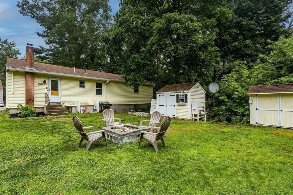 17 Pine Street Bellingham, MA 02019 - Photo 18 of 26 a backyard of a house with table and chairs