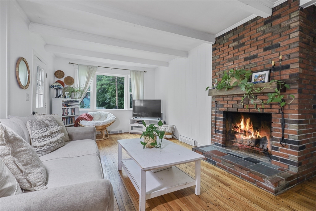 17 Pine Street Bellingham, MA 02019 - Photo 6 of 26 a living room with furniture and a fireplace