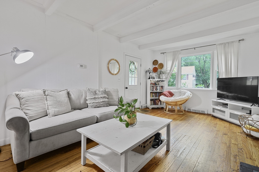 17 Pine Street Bellingham, MA 02019 - Photo 7 of 26 a living room with furniture and a flat screen tv