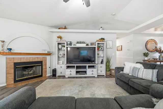 a bathroom with a granite countertop sink and a toilet