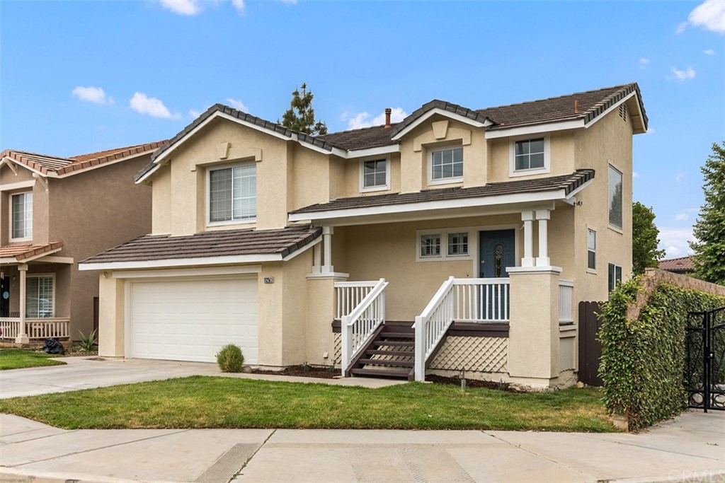 11250 Mathilda Lane Riverside, CA 92508 - Photo 1 of 1 a front view of a house with a yard and garage