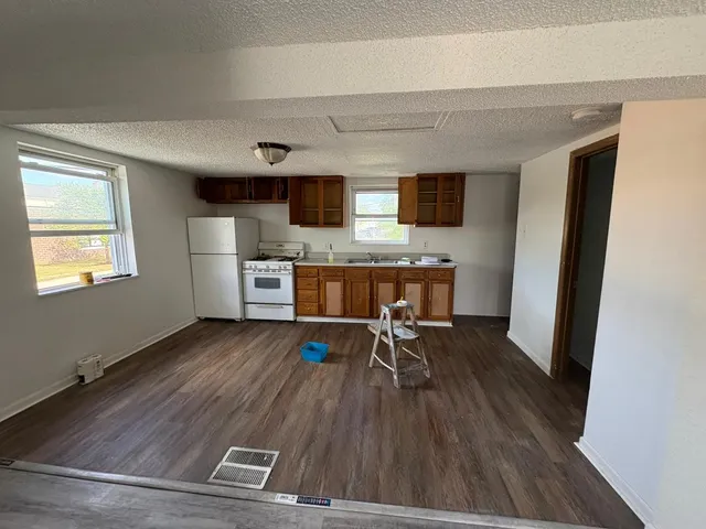 a view of a livingroom with furniture and wooden floor