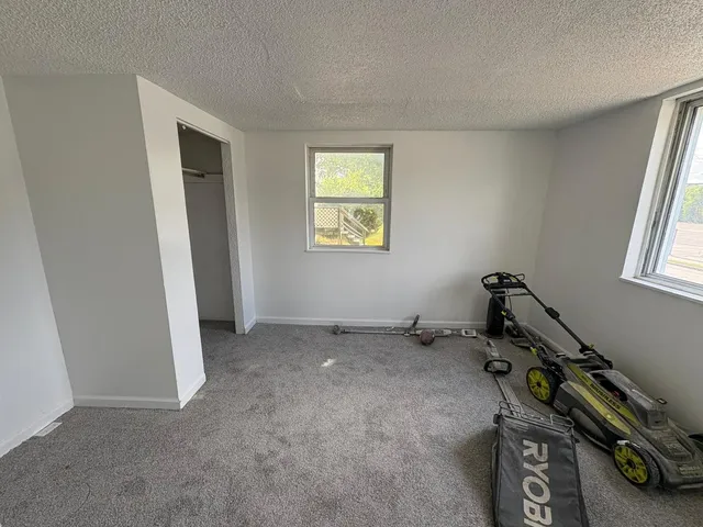 a room with gym equipment and a window