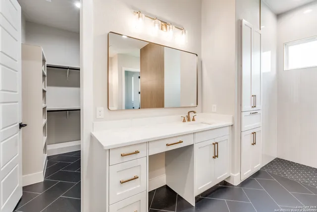 a bathroom with a sink and a mirror