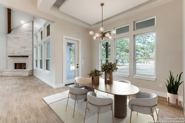 a view of a dining room with furniture window and wooden floor