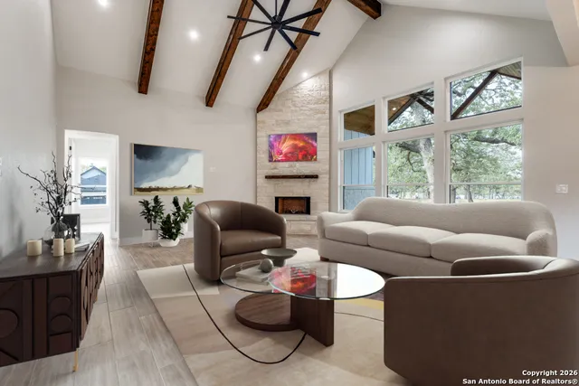 a living room with furniture and a large window