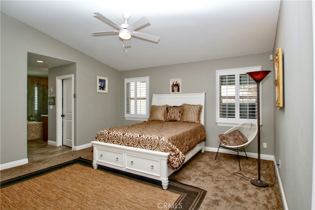 6202 Mandarin Road Yucca Valley, CA 92284 - Photo 13 of 24 a bedroom with a bed and window
