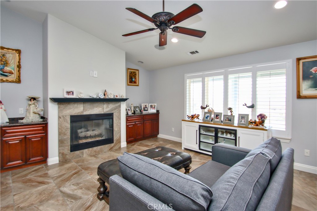 6202 Mandarin Road Yucca Valley, CA 92284 - Photo 8 of 24 a living room with furniture and a fireplace