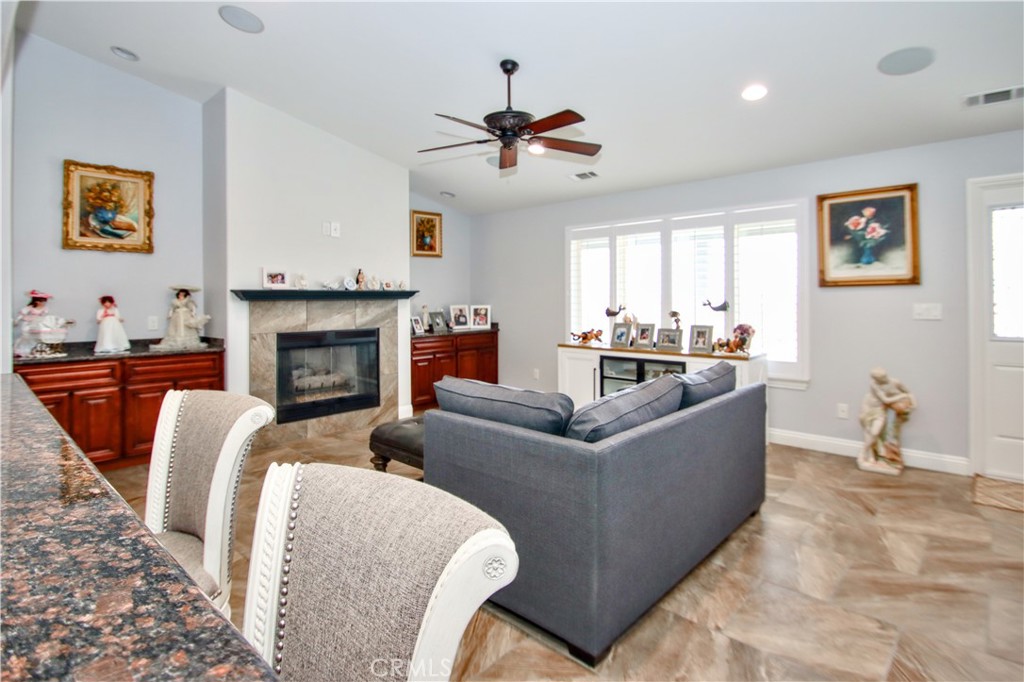 6202 Mandarin Road Yucca Valley, CA 92284 - Photo 10 of 24 a living room with furniture and a fireplace