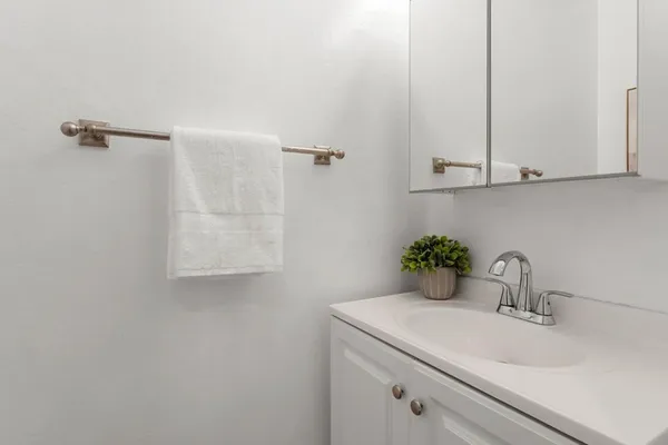 a bathroom with a sink and vanity