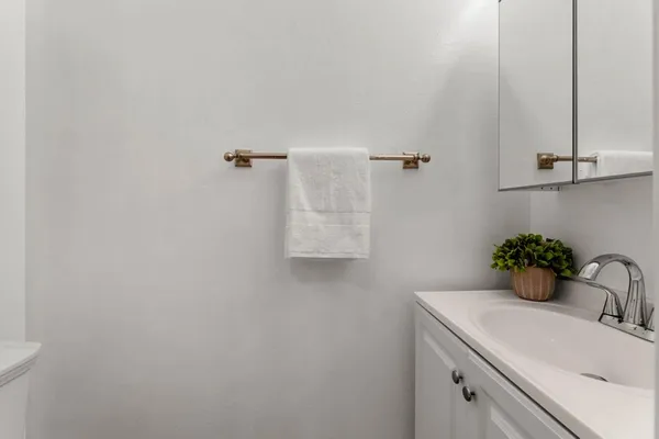a bathroom with a sink and mirror