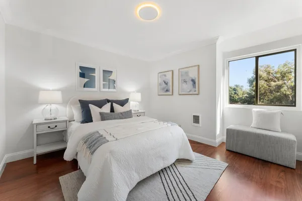 a bedroom with a bed and a couch