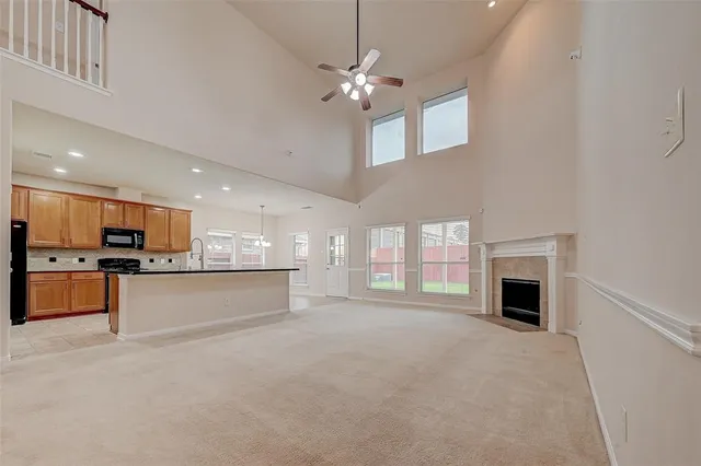 a view of a kitchen with a sink and a fireplace