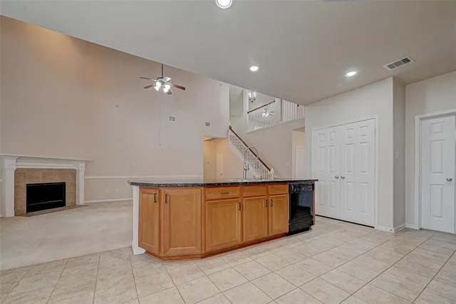 a room with cabinets and a fireplace