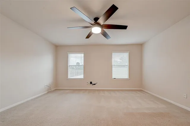 an empty room with window and windows