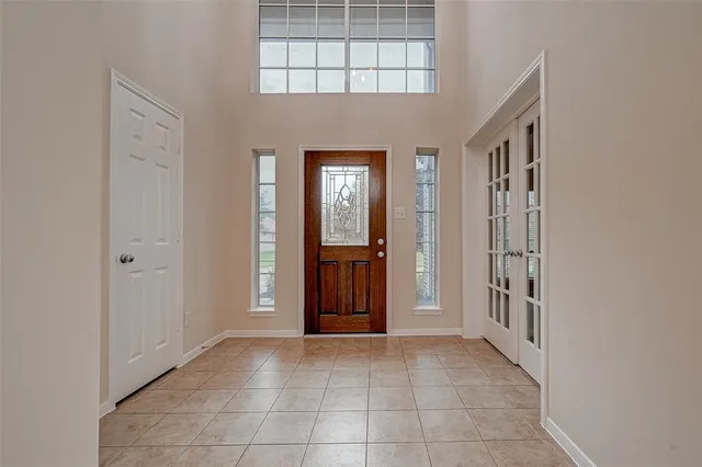 a view of a hallway with entryway door