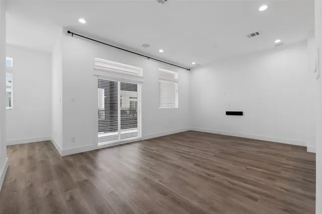 a view of a kitchen with a sink and a refrigerator