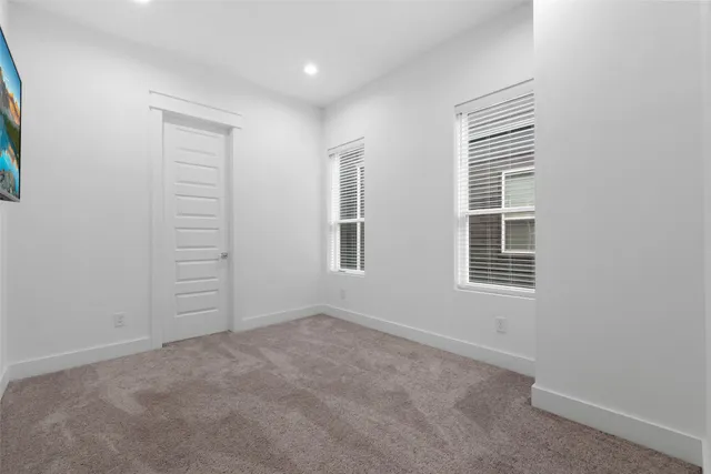 a kitchen with a stove and a refrigerator