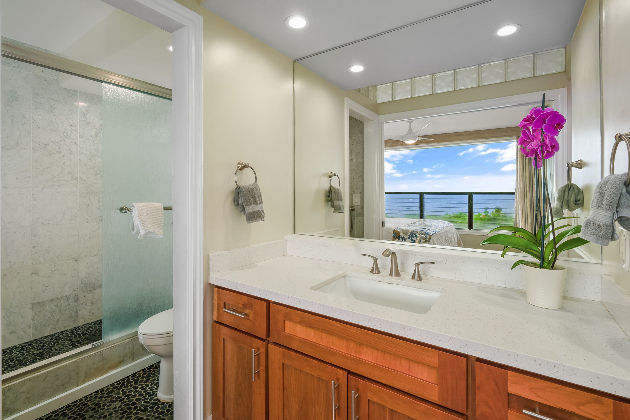 1775 Pe'e Road, Unit 101A Koloa, HI 96756 - Photo 14 of 25 a bathroom with a sink a toilet and shower