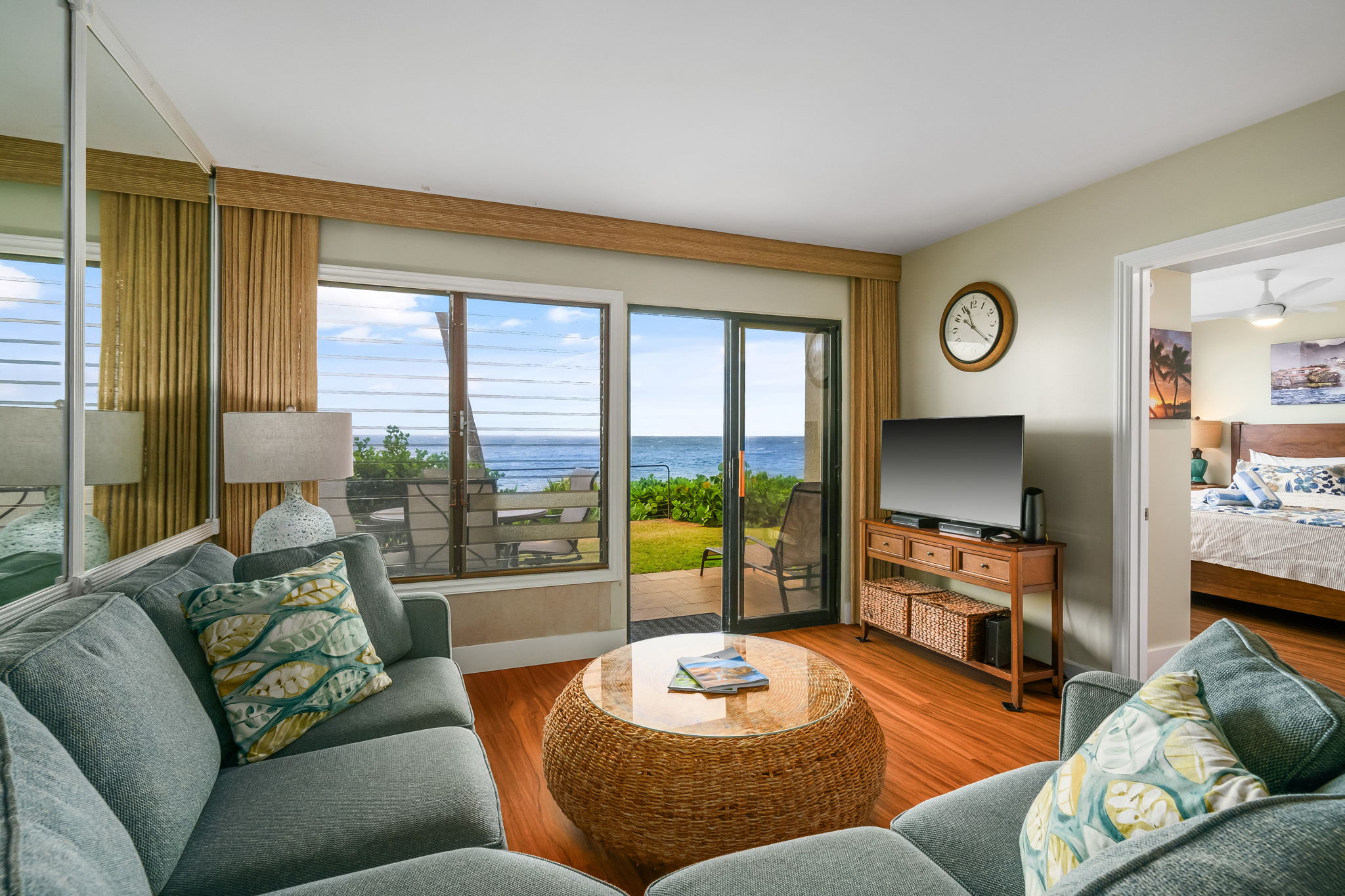 1775 Pe'e Road, Unit 101A Koloa, HI 96756 - Photo 18 of 25 a living room with furniture and a flat screen tv