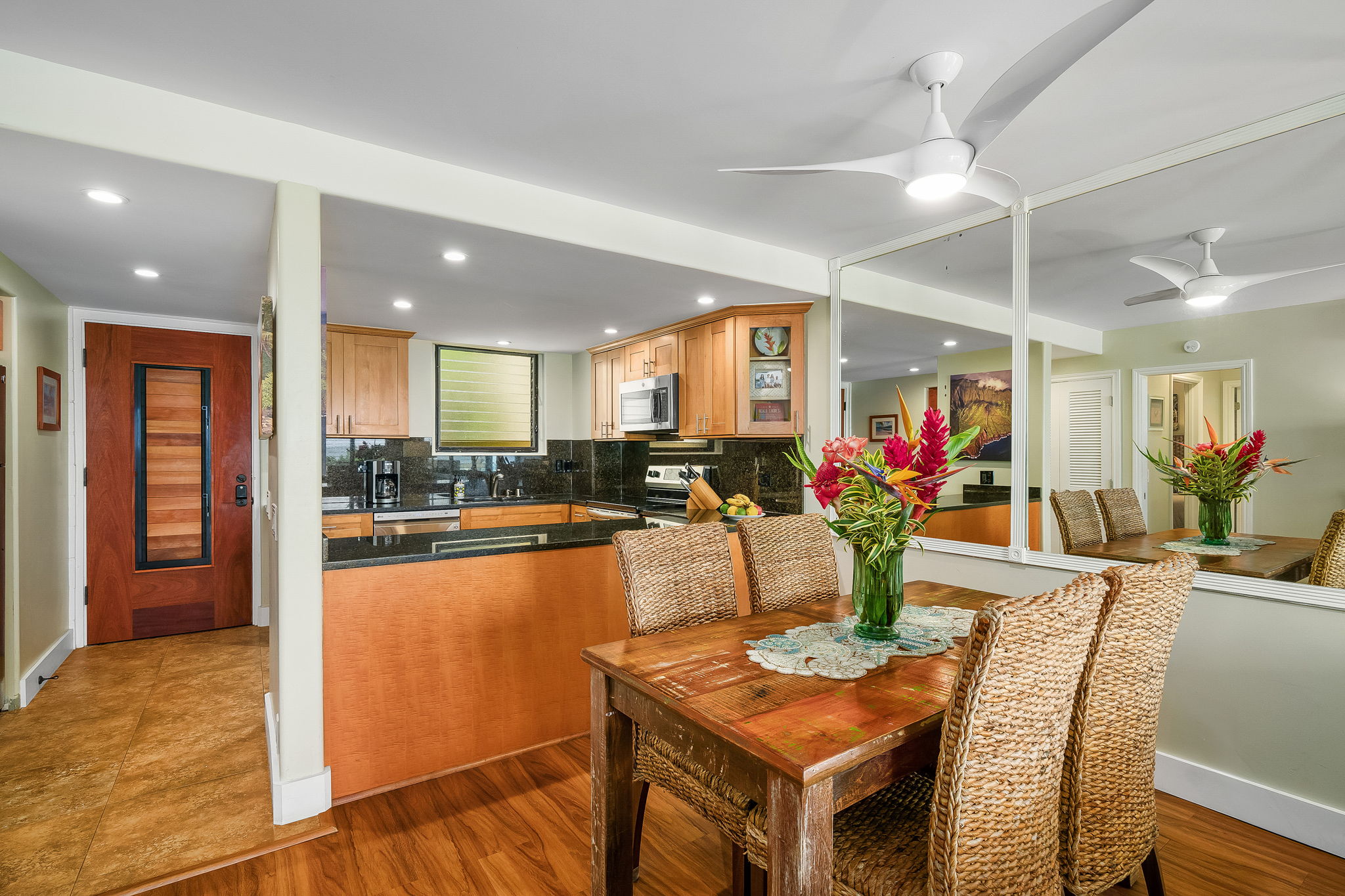 1775 Pe'e Road, Unit 101A Koloa, HI 96756 - Photo 9 of 25 a view of a dining room with furniture window and wooden floor