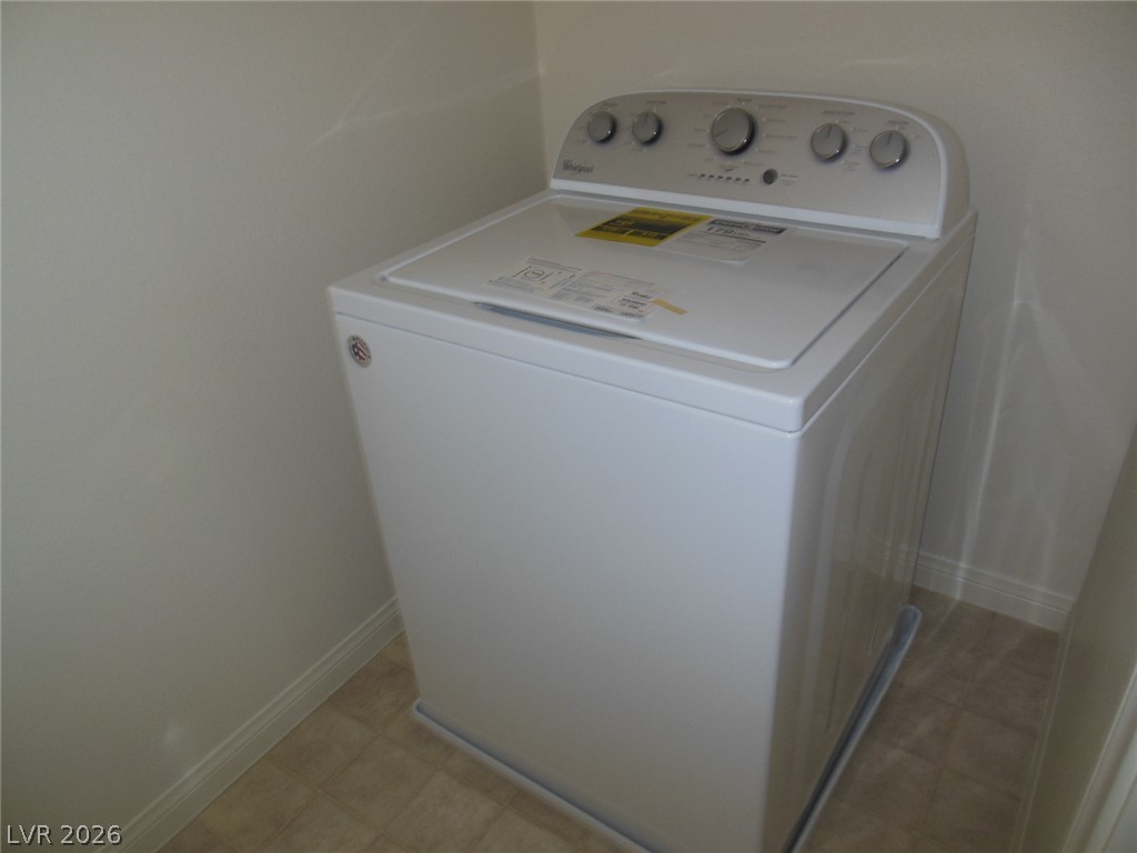 6390 Jackson Spring Road Las Vegas, NV 89118 - Photo 21 of 27 Streamlined laundry area with convenient washer, ready for everyday tasks.