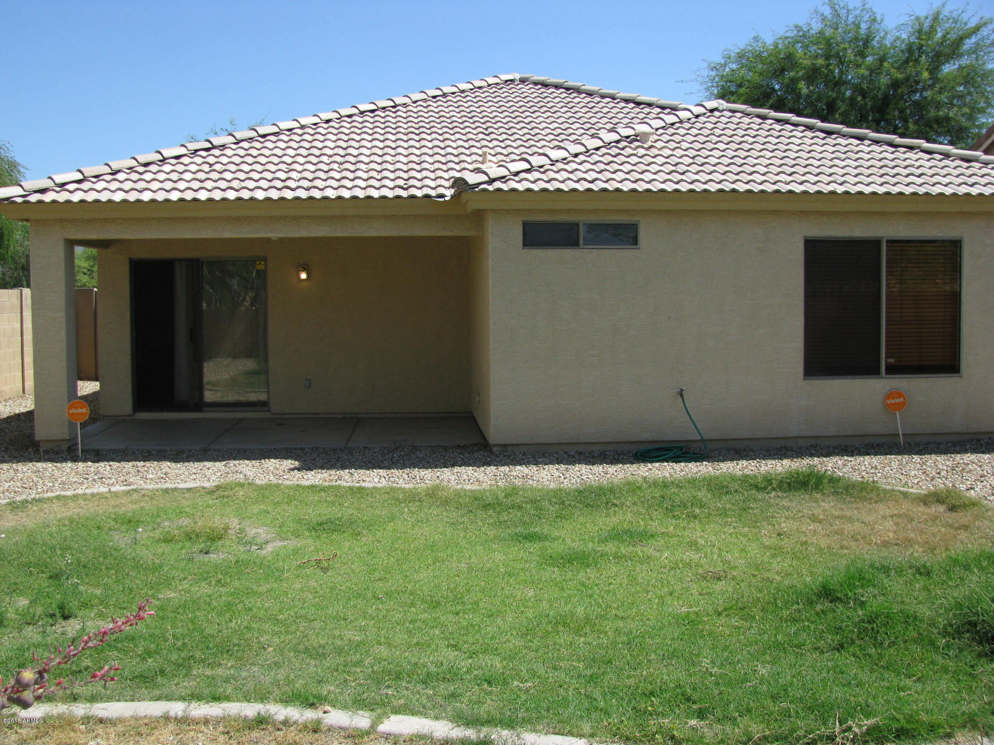 2302 West Maldonado Road Phoenix, AZ 85041 - Photo 18 of 19 a view of a house with a backyard