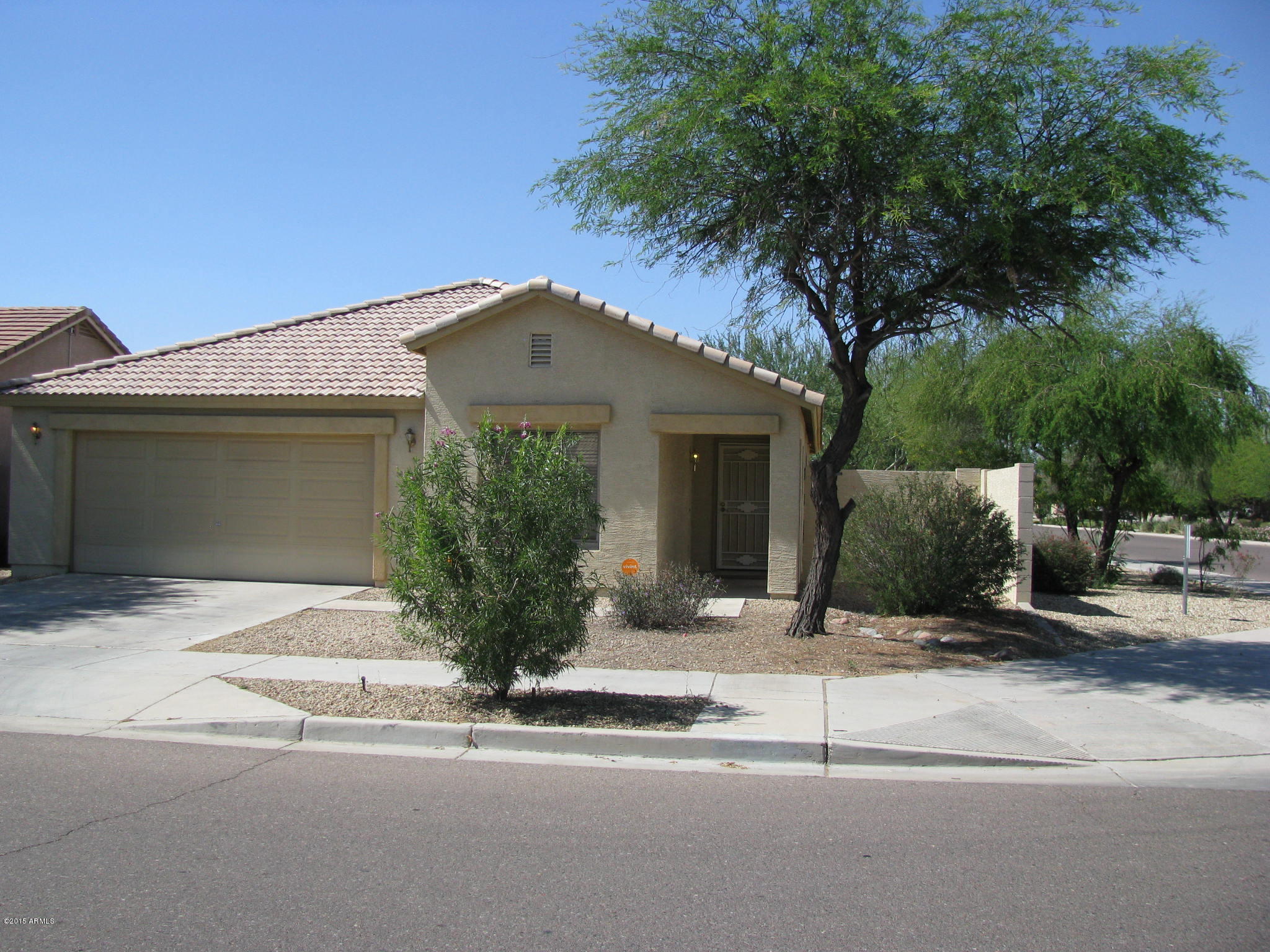 2302 West Maldonado Road Phoenix, AZ 85041 - Photo 3 of 19 a front view of a house with a yard