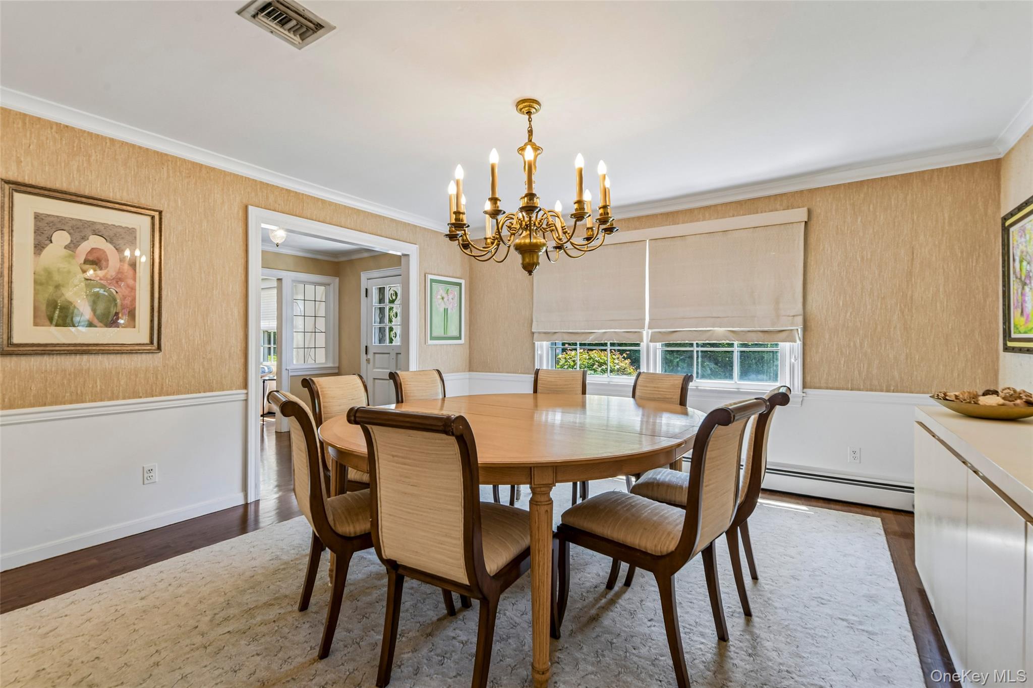 100 Hewlett Neck Road Woodmere, NY 11598 - Photo 12 of 45 a view of a dining room with furniture a chandelier and wooden floor