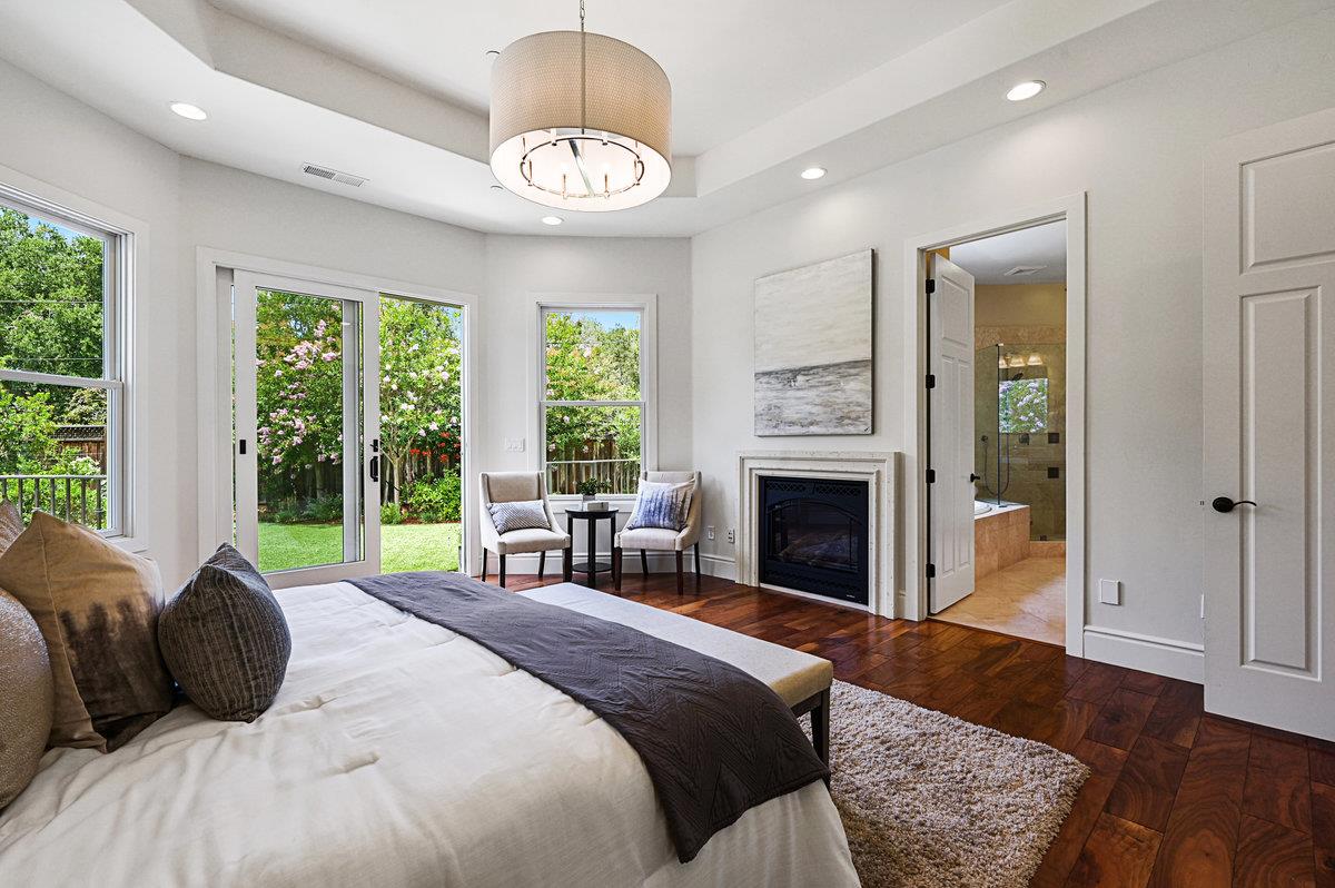 782 Dixon Way Los Altos, CA 94022 - Photo 12 of 38 a bedroom with a bed and a fireplace